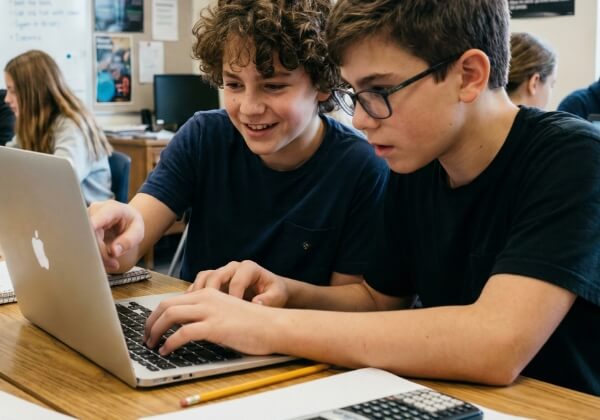 two boys at laptop