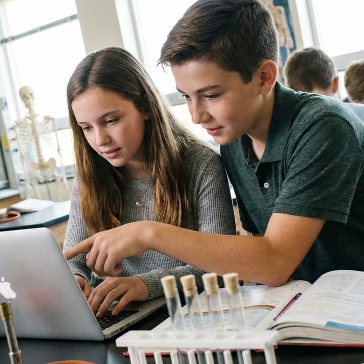 girl and boy in science lab